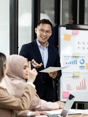 Business people, presentation and graphs for finance with financ Business people, presentation and graphs for finance with financial or marketing charts on a board and share information in meeting.